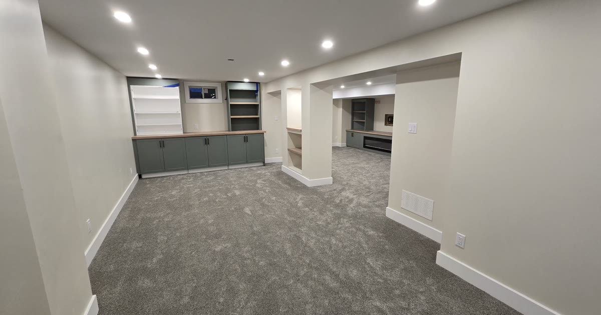 Basement family room with green cabinets — HandKind Construction, Paris Ontario