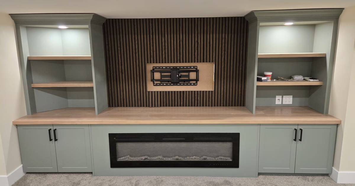 Basement entertainment wall with fireplace — HandKind Construction, Brant County