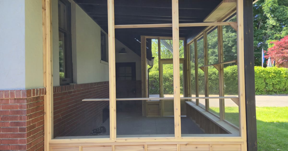 Completed screened cat porch — cedar knee wall and pet-resistant screen, Paris Ontario