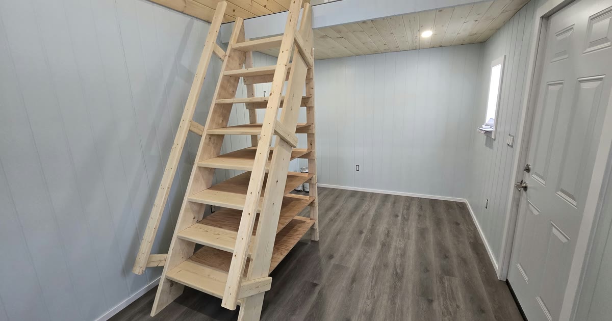 Finished he-shed interior — knotty pine ceiling, shiplap walls, LVP flooring, Paris Ontario