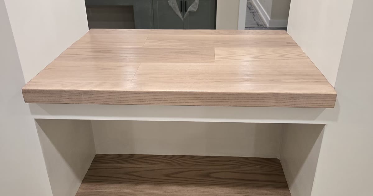Wood kitchen cabinetry with display niches — a HandKind Construction renovation